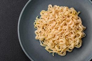 Rice noodles with fish and sauce, salt and spices photo