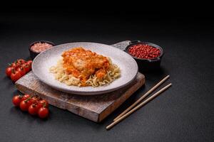 Rice noodles with fish and sauce, salt and spices photo