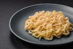 Rice noodles with fish and sauce, salt and spices photo