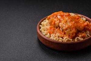 Rice noodles with fish and sauce, salt and spices photo
