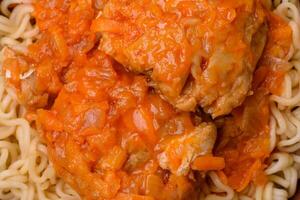 Rice noodles with fish and sauce, salt and spices photo