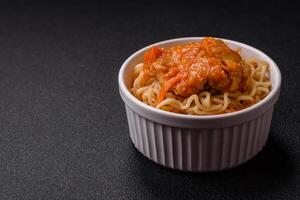 Rice noodles with fish and sauce, salt and spices photo