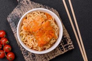Rice noodles with fish and sauce, salt and spices photo