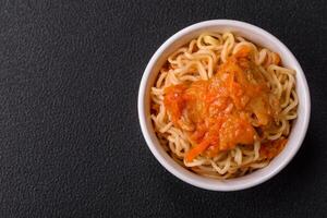 Rice noodles with fish and sauce, salt and spices photo
