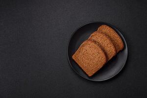 Fresh crispy brown bread sliced from whole grain flour photo