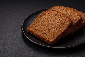 Fresh crispy brown bread sliced from whole grain flour photo