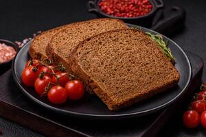 Fresh crispy brown bread sliced from whole grain flour photo