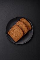 Fresh crispy brown bread sliced from whole grain flour photo