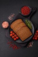 Fresh crispy brown bread sliced from whole grain flour photo