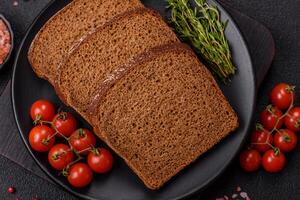 Fresh crispy brown bread sliced from whole grain flour photo