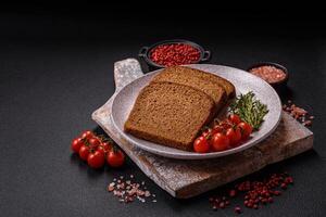 Fresh crispy brown bread sliced from whole grain flour photo