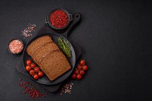 Fresh crispy brown bread sliced from whole grain flour photo