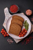 Fresh crispy brown bread sliced from whole grain flour photo