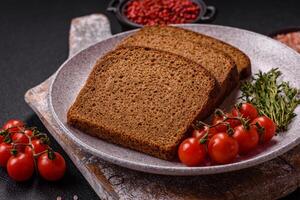 Fresh crispy brown bread sliced from whole grain flour photo