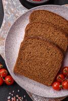 Fresh crispy brown bread sliced from whole grain flour photo