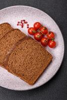 Fresh crispy brown bread sliced from whole grain flour photo