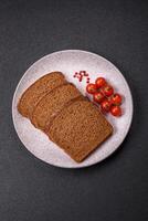 Fresh crispy brown bread sliced from whole grain flour photo