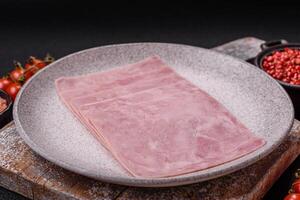Ham cut into square slices for making delicious nutritious sandwiches photo