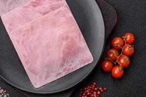 Ham cut into square slices for making delicious nutritious sandwiches photo