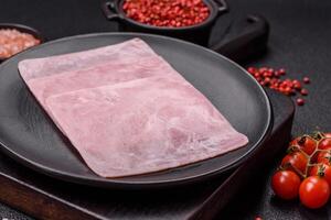 Ham cut into square slices for making delicious nutritious sandwiches photo