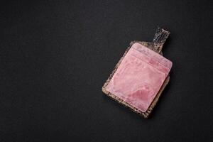 Ham cut into square slices for making delicious nutritious sandwiches photo