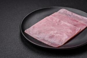 Ham cut into square slices for making delicious nutritious sandwiches photo