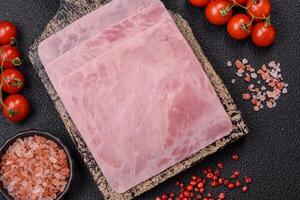 Ham cut into square slices for making delicious nutritious sandwiches photo