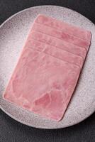 Ham cut into square slices for making delicious nutritious sandwiches photo