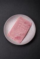 Ham cut into square slices for making delicious nutritious sandwiches photo