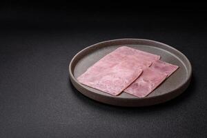 Ham cut into square slices for making delicious nutritious sandwiches photo