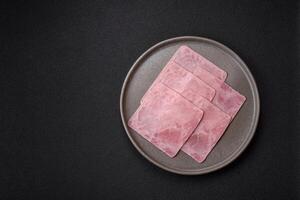 Ham cut into square slices for making delicious nutritious sandwiches photo