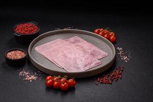 Ham cut into square slices for making delicious nutritious sandwiches photo