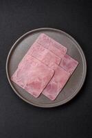 Ham cut into square slices for making delicious nutritious sandwiches photo