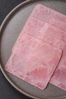 Ham cut into square slices for making delicious nutritious sandwiches photo
