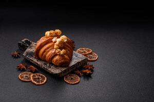 Sweet crispy croissant with salted caramel and glazed popcorn photo