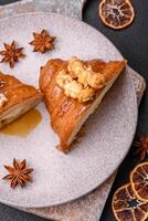 Sweet crispy croissant with salted caramel and glazed popcorn photo