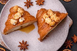 Sweet crispy croissant with salted caramel and glazed popcorn photo