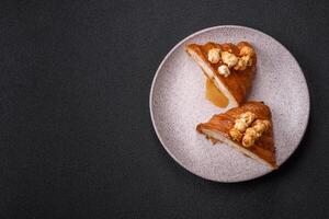 Sweet crispy croissant with salted caramel and glazed popcorn photo