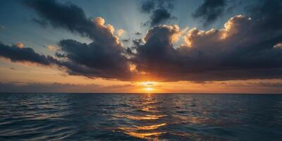 A serene ocean scene as the sunrise breaks through dramatic clouds casting a spectrum of colors reflected in the water. photo