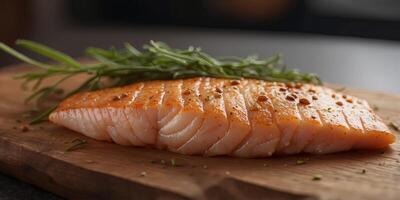 ranw fish meant sanlmon fish fillet on brown chopping boanrd. photo