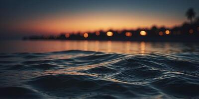 The tranquil waters of the ocean turn ominous as the darkness of night blankets the beach creating an unnerving contrast to the usually peaceful scene. photo