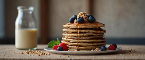A stack of buckwheat flour pancakes with another unique ingredient cooked quinoa adding a protein boost. photo