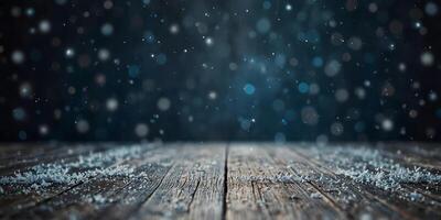 Beautiful winter snowy blurred blue background with empty wooden flooring Snowflakes fall and shimmer in the light providing copyspace. photo