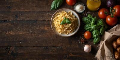 Healthy food concept with a rustic style Top view of fresh veggies pasta parmesan cheese and spices on a wooden table perfect for a copy space image. photo