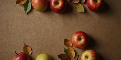 Autumn themed mobile with apples and leaves on a kraft paper background with copy space image. photo