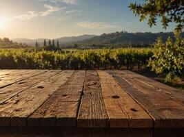 empty wooden table with a perspective of the early morning sun over a tuscan vineyard. photo