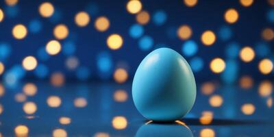 An egg in front of a mirror opposite its Easter dots reflection Blue background Creative Easter idea. photo