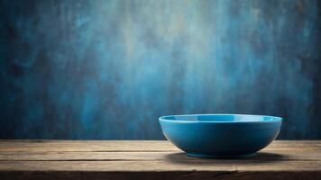 An empty blue plate on a rustic wooden table top background. photo
