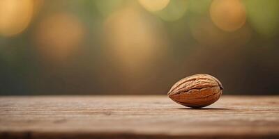 Macro Shot of Solitary Almond on Rustic Wooden Surface with Blurred Background. photo