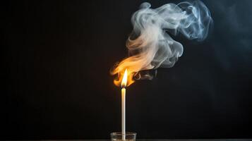 A single candle standing tall, with the smoke from its extinguished wick slowly spreading out and engulfing the frame. photo